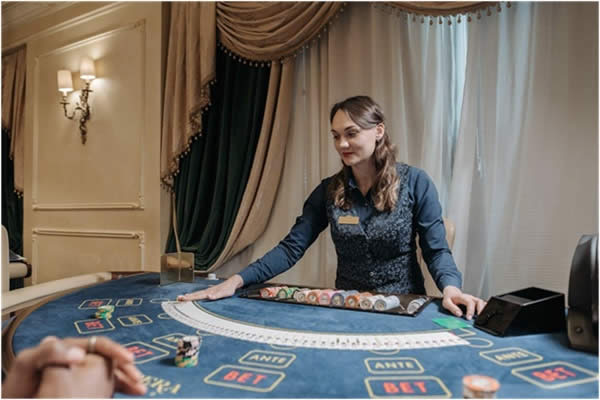 Live dealer at casino card table