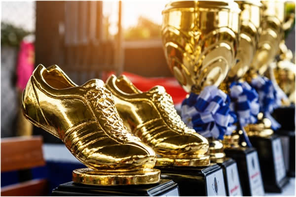 Golden boot awards beside winner cups 